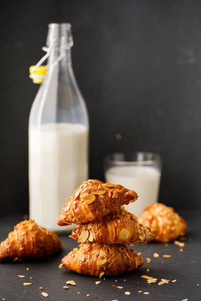 istock Croissants on the table with milk 1412382093