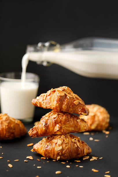 istock Croissants on the table with milk 1412382097