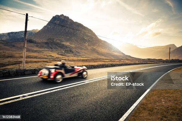 Open Top Classic Sports Car Driving Through Snowdonia Wales United Kingdom Europe Stock Photo - Download Image Now