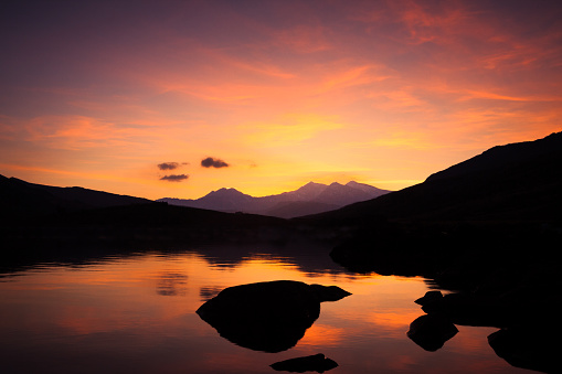 Snow-capped Snowdon Mountain range viewed at sunset over Llynnau Mymbyr, Snowdonia National Park, Wales, United Kingdom, Europe