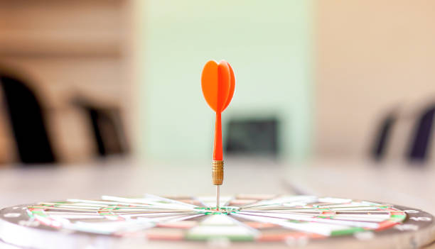 istock Dart dashes into the Dartboard. as a business goal. 1412385595