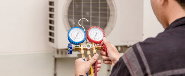 istock Technician checking the operation of the air conditioner 1412385596