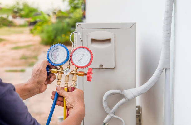 istock Technician checking the operation of the air conditioner 1412385636
