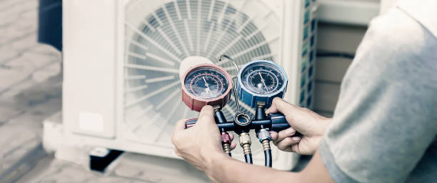 istock Technician checking the operation of the air conditioner 1412386397