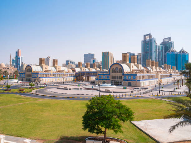 View of the central Souq in Sharjah, UAE Sharjah downtown, with the Central Souq in the foreground and downton's skyscrapers in the background. sharjah city stock pictures, royalty-free photos & images