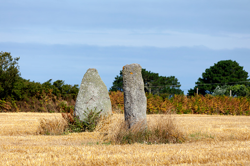 Kerguiabo menhirs in the middle of a field in the town of Plourin in Finistère, Brittany.
