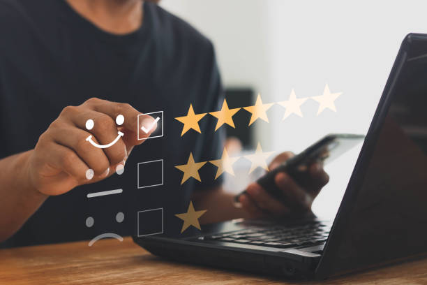 istock Online customer service and satisfaction survey concept with internet technology. Finger of businessman touching and check mark icon face emoticon smile, service mind, service rating. Work from home. 1412387999