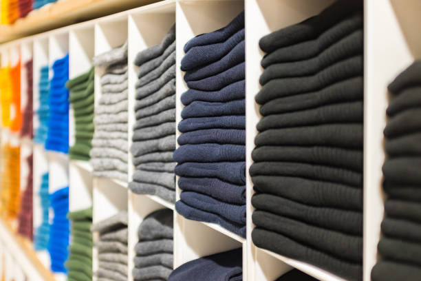 istock Multi colored socks stacked on shelves in the store 1412388332