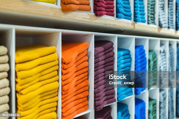 Multi Colored Socks Stacked On Shelves In The Store Stock Photo - Download Image Now