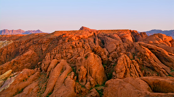 Aerial view of orange cliffs and domes of the valley of fire at sunset, Nevada, USA.