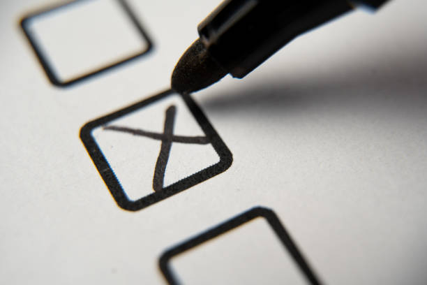 Check the box in the checklist with a black marker. Completed and completed task, obligation, obligation or responsibility