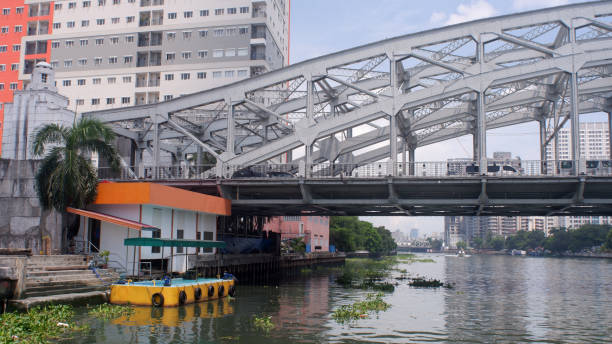 istock Manila, Philippines - July 11, 2022: Floating passenger dock on murky polluted Pasig River under the iron bridge 1412396726
