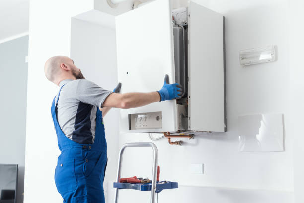 Professional boiler service at home Professional engineer doing a boiler inspection at home boiler stock pictures, royalty-free photos & images