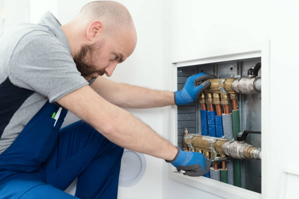 istock Professional plumber installing plumbing manifolds 1412399619