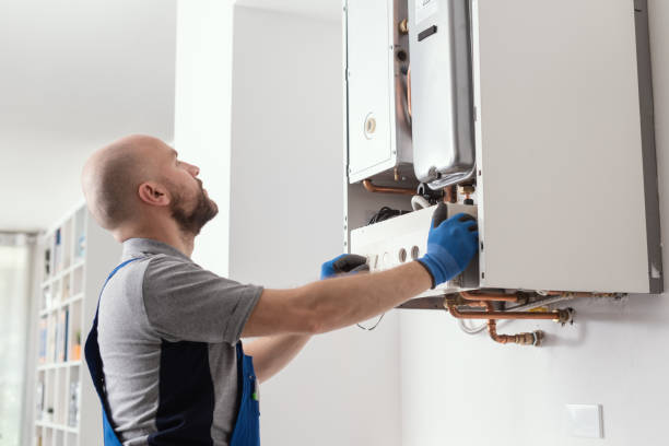 Professional boiler service at home Professional qualified engineer testing a gas boiler after repair heating engineer stock pictures, royalty-free photos & images