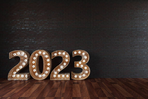 2023 Bulb Sign Against Black Wall and Copy Space stock photo