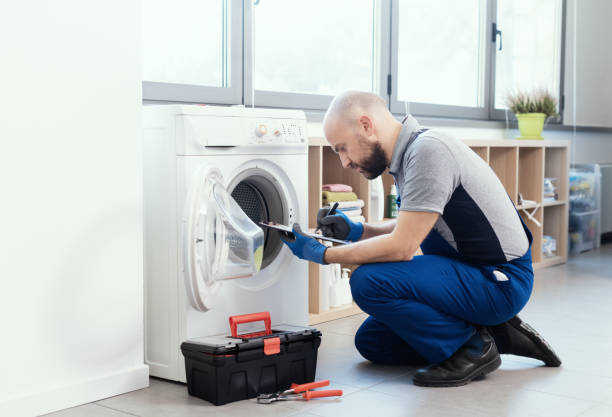 istock Professional repairman writing an invoice 1412400477