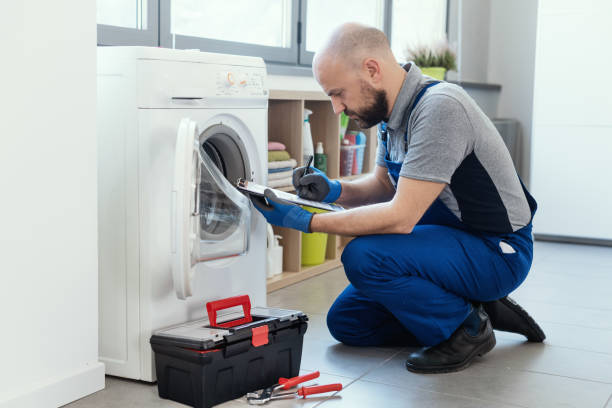 istock Professional repairman writing an invoice 1412401432