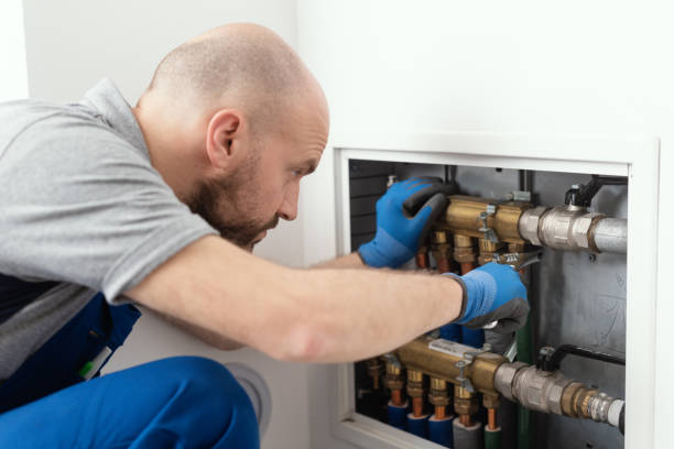 istock Professional plumber installing plumbing manifolds 1412401722