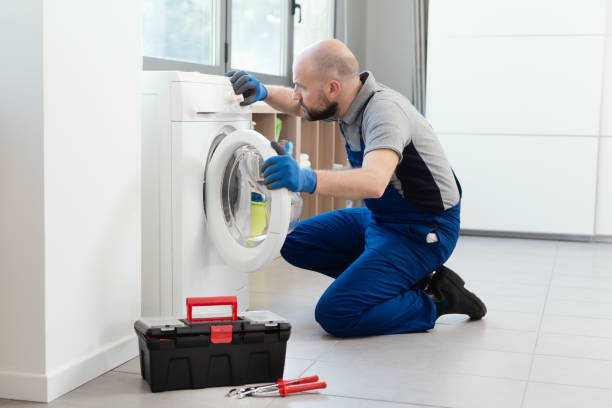 istock Professional repairman fixing a washer 1412401979