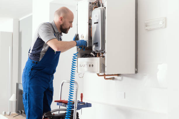 professional engineer servicing a boiler at home - heating engineer imagens e fotografias de stock