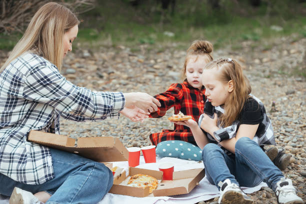 istock people on a picnic in nature 1412405014