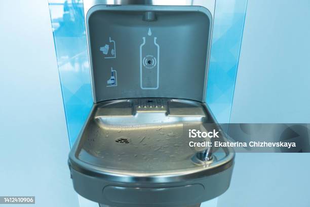 Modern Drinking Water Fountain At The Airport Stock Photo - Download Image Now - Refill, Water, Station