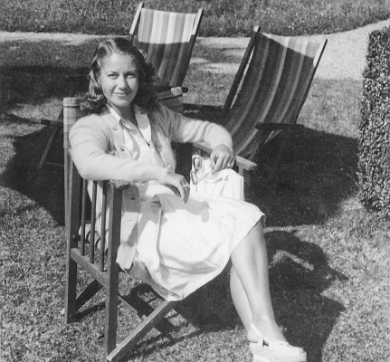Young woman on outdoor chair in a garden 1941.