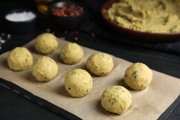 istock Many raw falafel balls on black table 1412413041