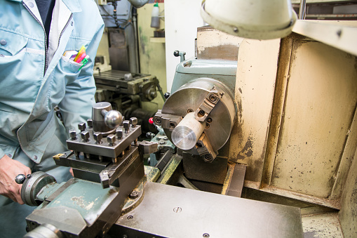 people working in a small town factory