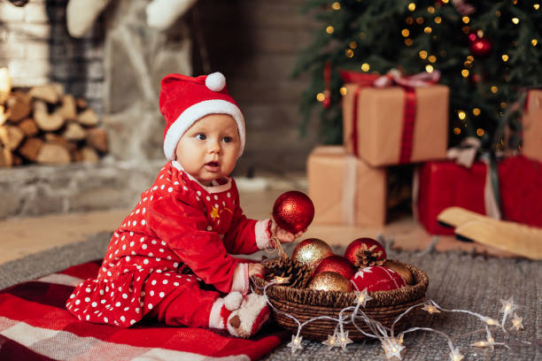 istock The little girl under the Christmas tree 1412414864