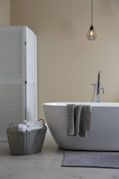 istock Soft grey mat on floor near tub in bathroom. Interior design 1412415197
