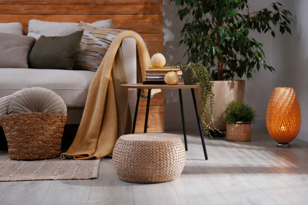 istock Stylish living room interior with comfortable sofa and wicker pouf 1412416805