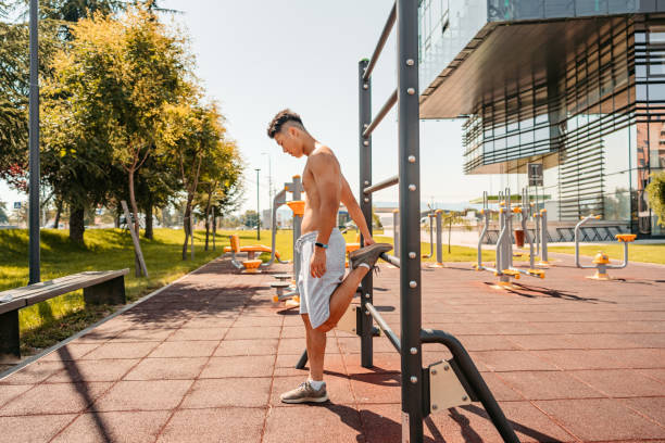 istock Young Man Stretching Before A Workout Outdoors 1412417522