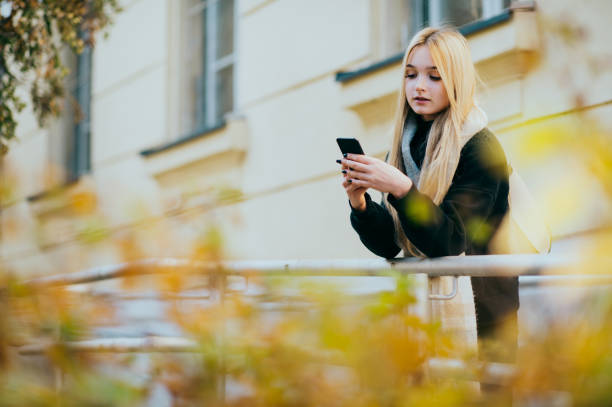 istock Young woman using the phone 1412419532