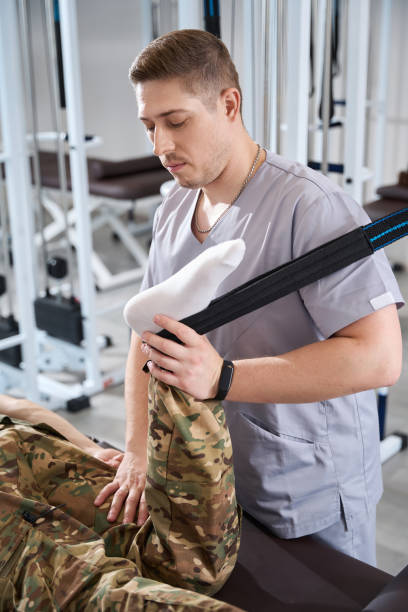 istock Doctor using special simulators in a rehabilitation sanatorium 1412421932