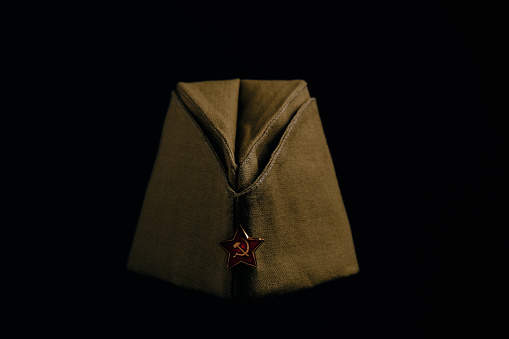 Cap with red star, headdress serviceman red army Soviet Union, on black background