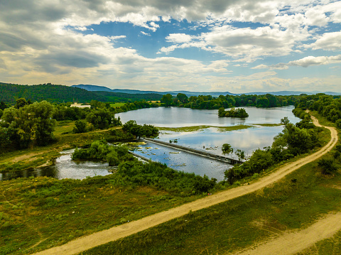 Drone point of view of Tundja river near Stara Zagora (Bulagarian: Снимка с дрон на река Тунджа в близост до Стара Загора, България). The photo is taken with DJI quadcopter Mavic III