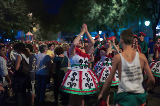 Lisbon, Portugal - June 12, 2014: Women dressed in traditional folklore costumes warm up before parading in Lisbon downtown during this city celebrations of the Popular Saints.