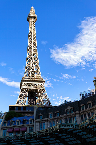 Paris, France - June 17, 2016: A shot of the world famous Eiffel Tower during the EUFA Euro Football Tournament 2016.  You can see the tower has been decorated in a football theme, and at the far end there is one of the fan parks where supporters can watch the matches live.