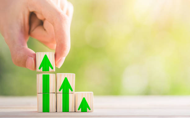 istock Hand arranging wood block stacking as step stair with arrow up. Ladder career path concept for business growth success process. concept for mortgage ladder investment. 1412425073