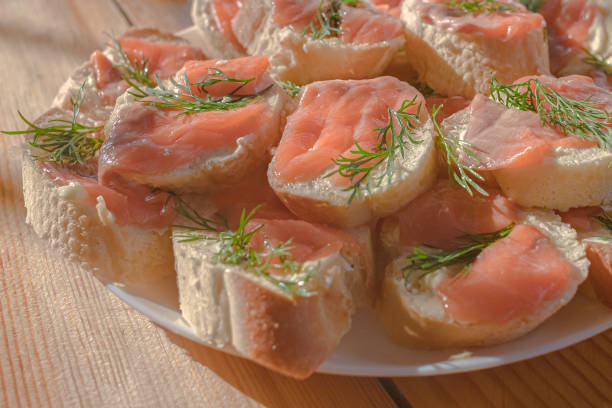 A plate of sandwiches with red fish