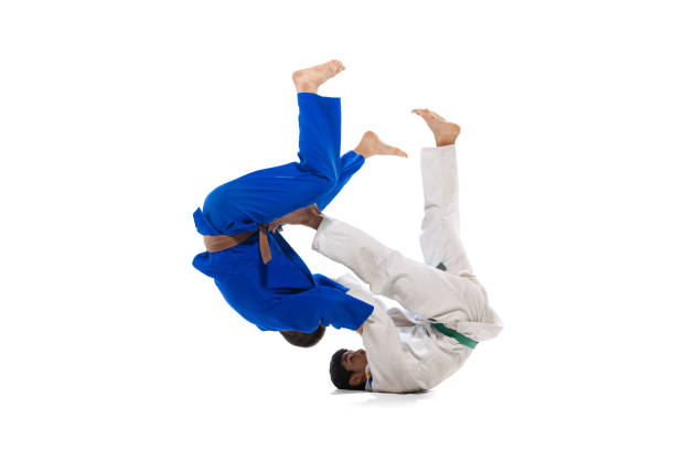 istock Studio shot of two men, professional judo athletes training isolated over white background 1412427984
