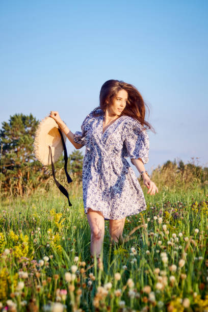 istock girl in the field 1412430410