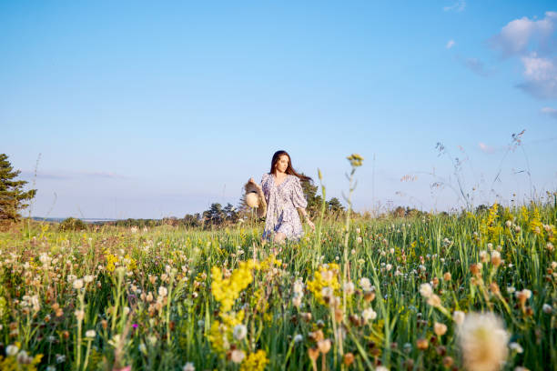 istock girl in the field 1412430644