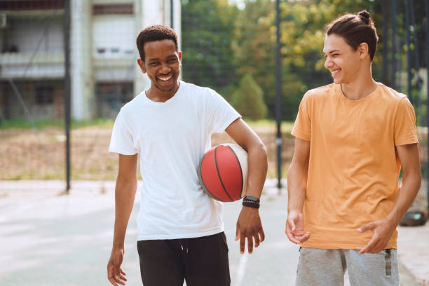 istock Friends playing basketball 1412432009