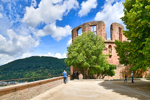Heidelberg, Germany - June 2022: Tower called 'Dicker Turm' at north western side of famous Heidelberg castle.\nThe medieval bulwark flanks the castle above the old town and Neckar river. It was built in 1533 under Ludwig V as part of the fortifications of Heidelberg Castle\n.
