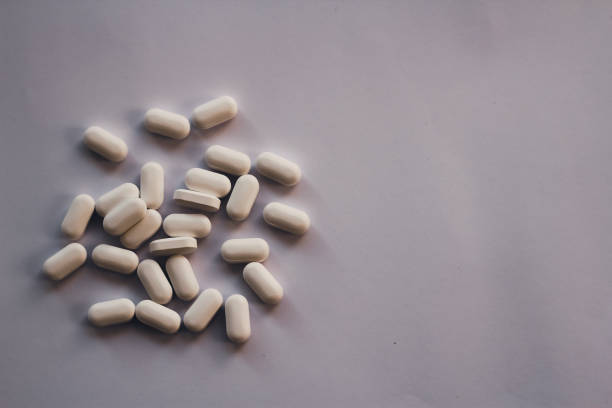 istock Medicine capsules on a white background 1412432152