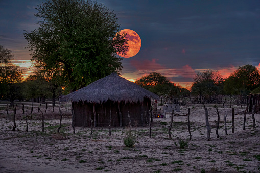 moonlight night scene African hut mud house in the village