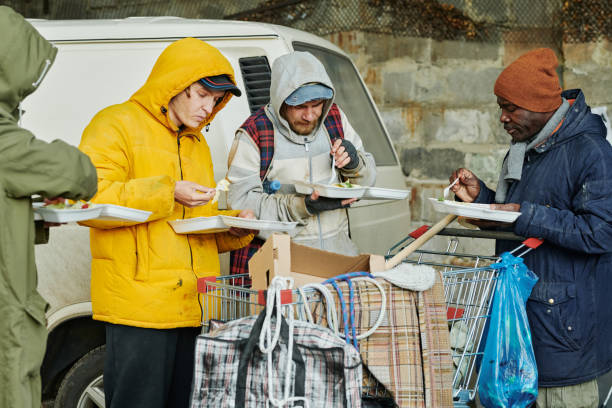 istock Homeless people eating hot food 1412433236